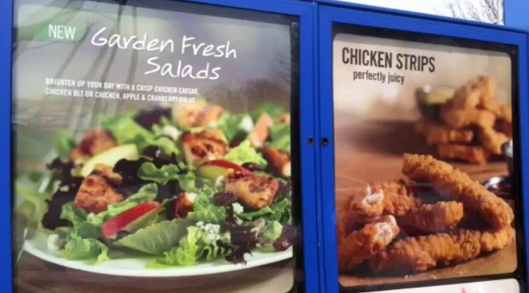 Garden Fresh Salads and Chicken Strips promotional display.