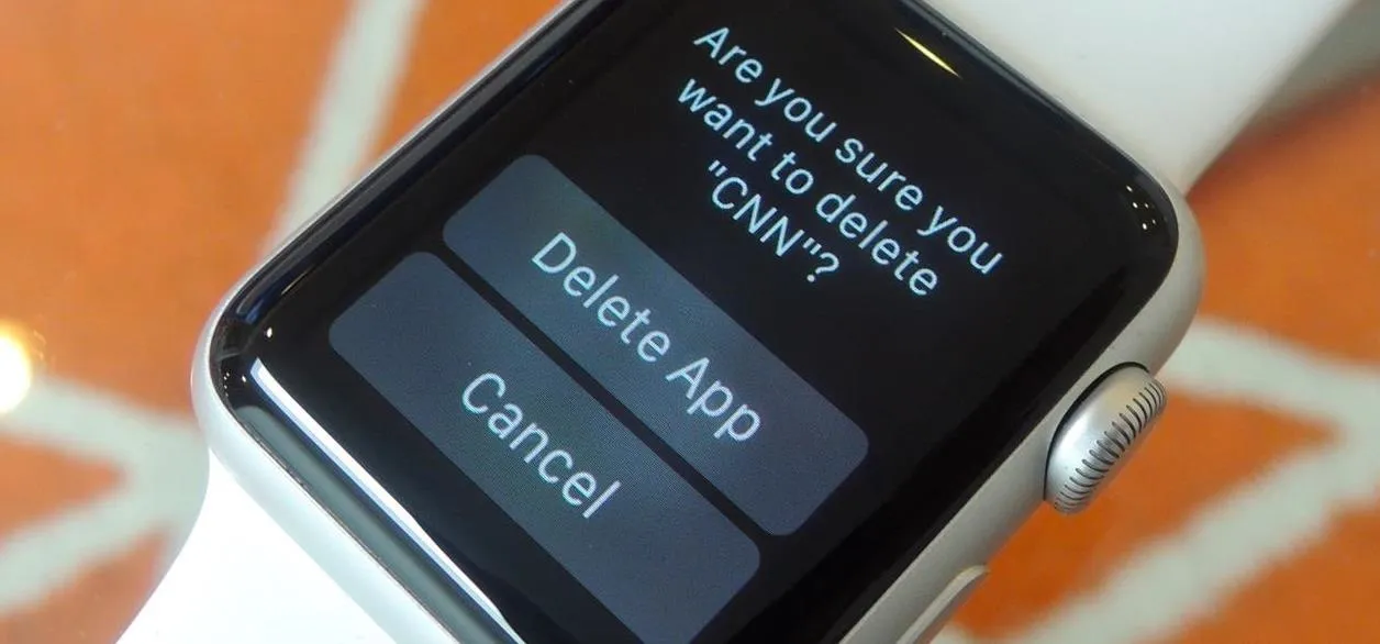 Smartwatch and smartphone displaying time and colorful app icons.