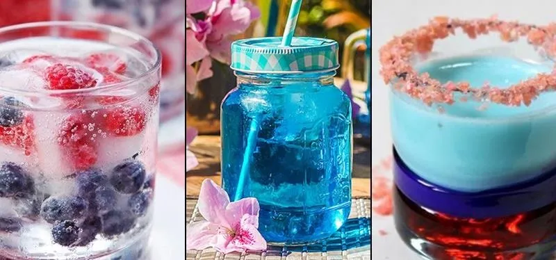Colorful summer beverages with fruit and decorative elements.