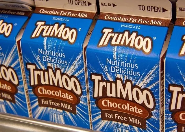TruMoo chocolate fat-free milk cartons on a store shelf.