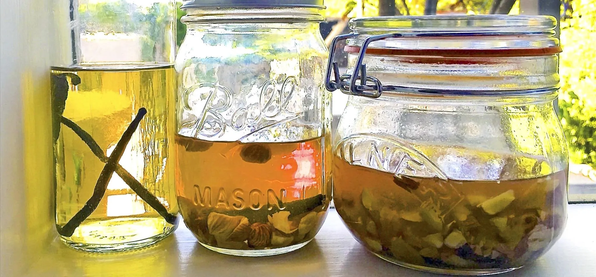 Bottles containing homemade herbal infusions.