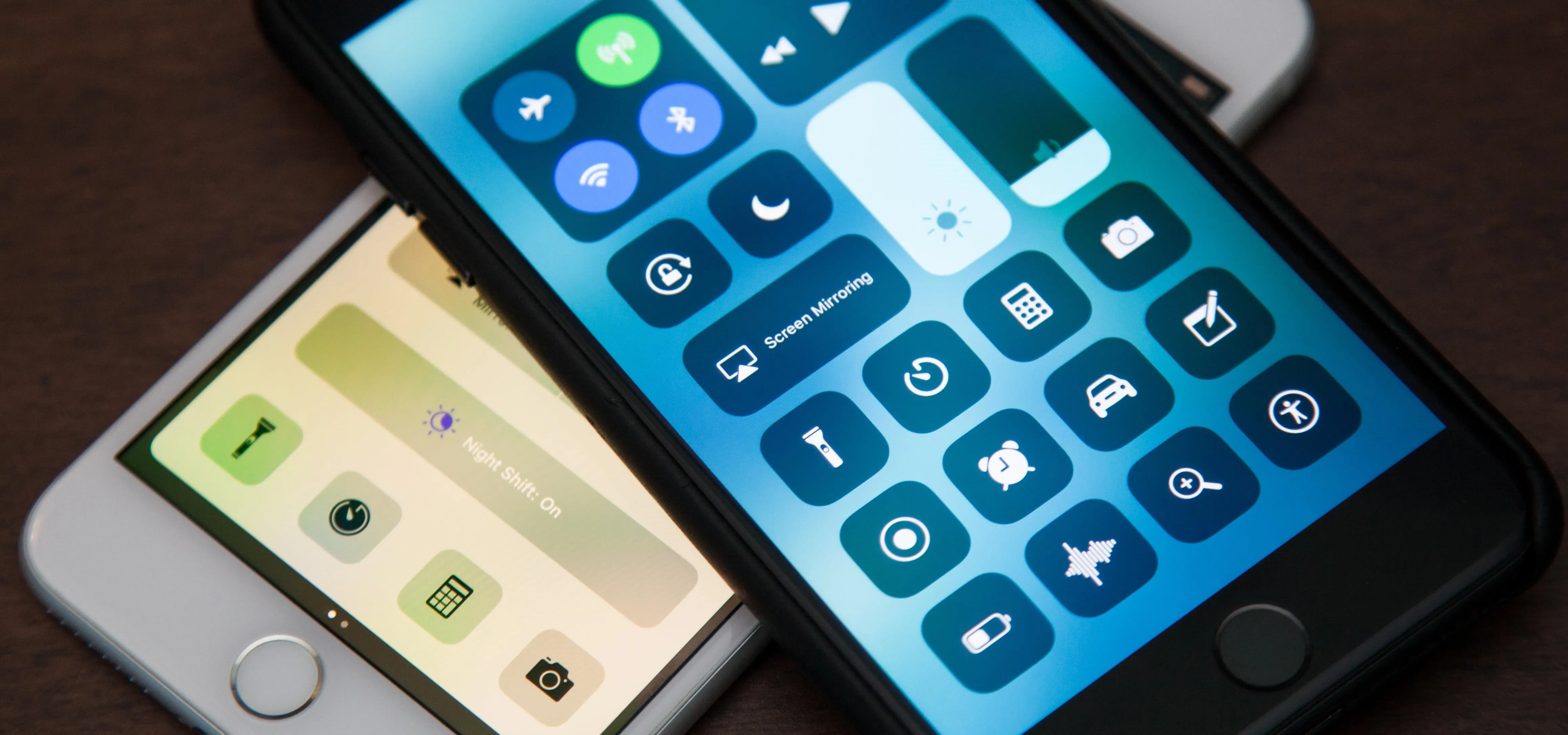 Smartphone control center interfaces displayed on two devices.
