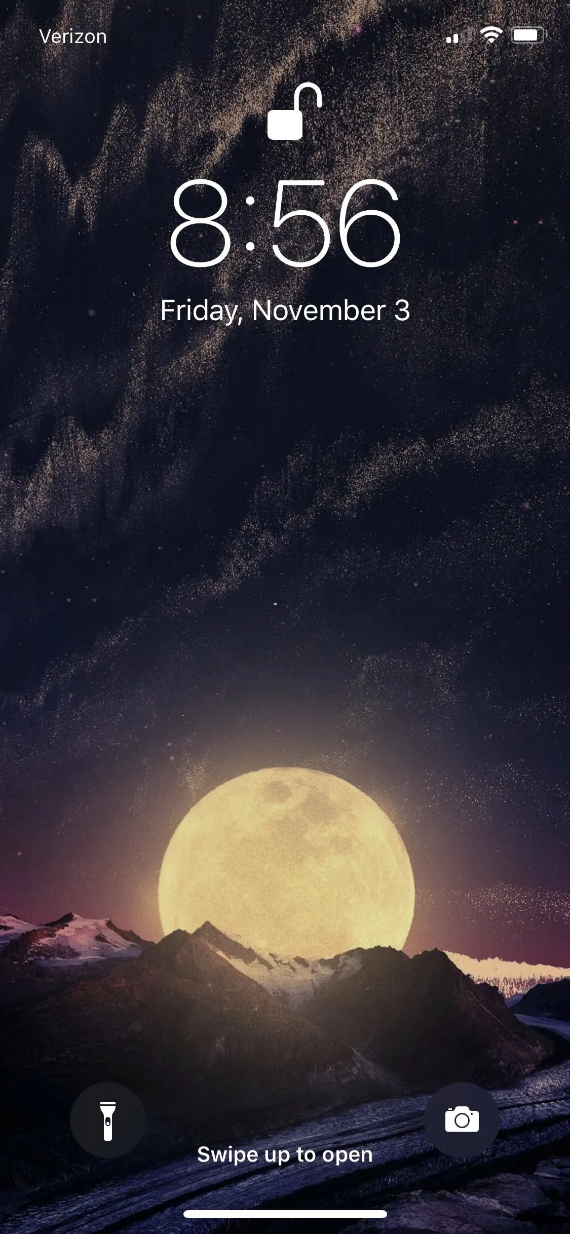 Stunning mobile wallpaper of a full moon over mountains at night.