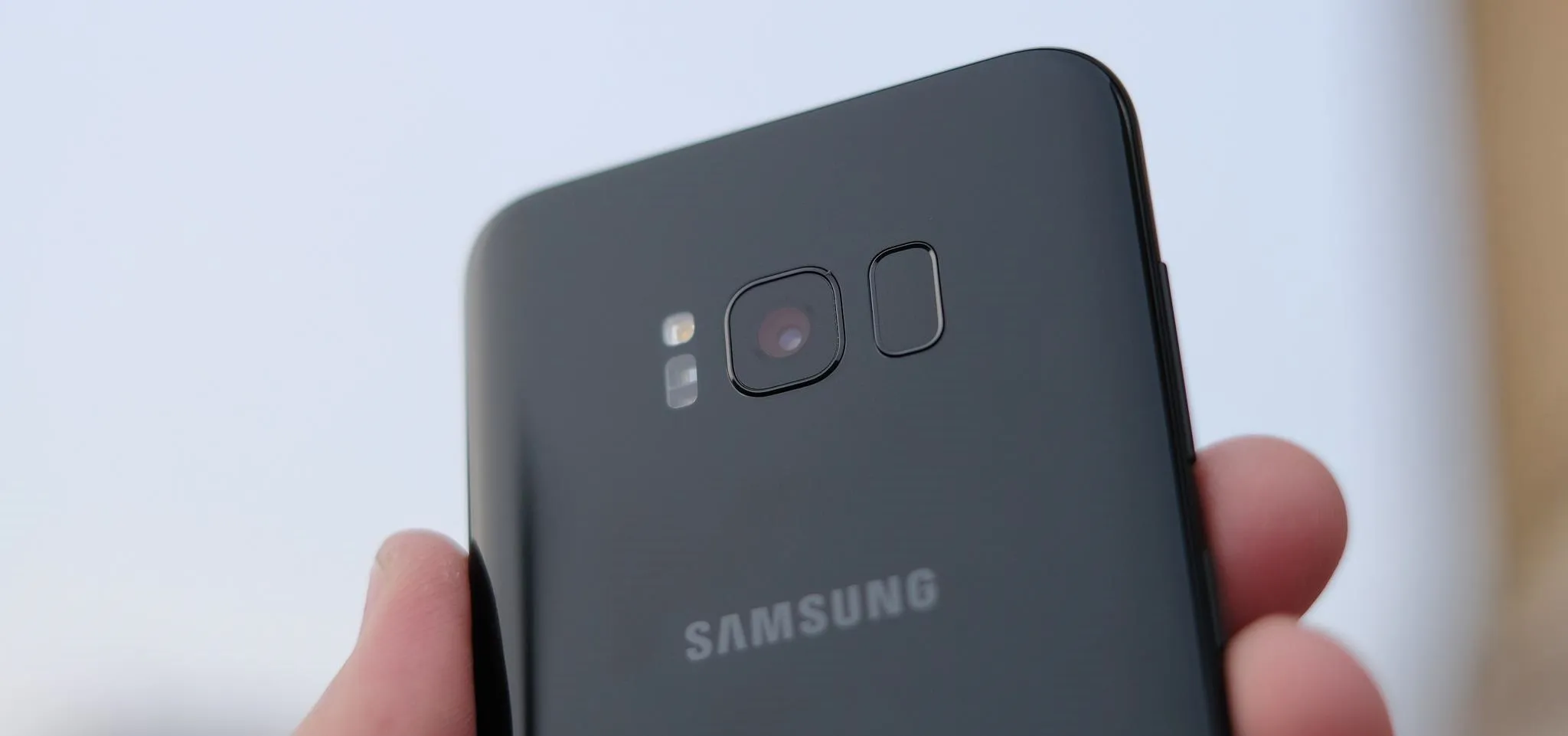 Samsung smartphone rear view with camera and logo.