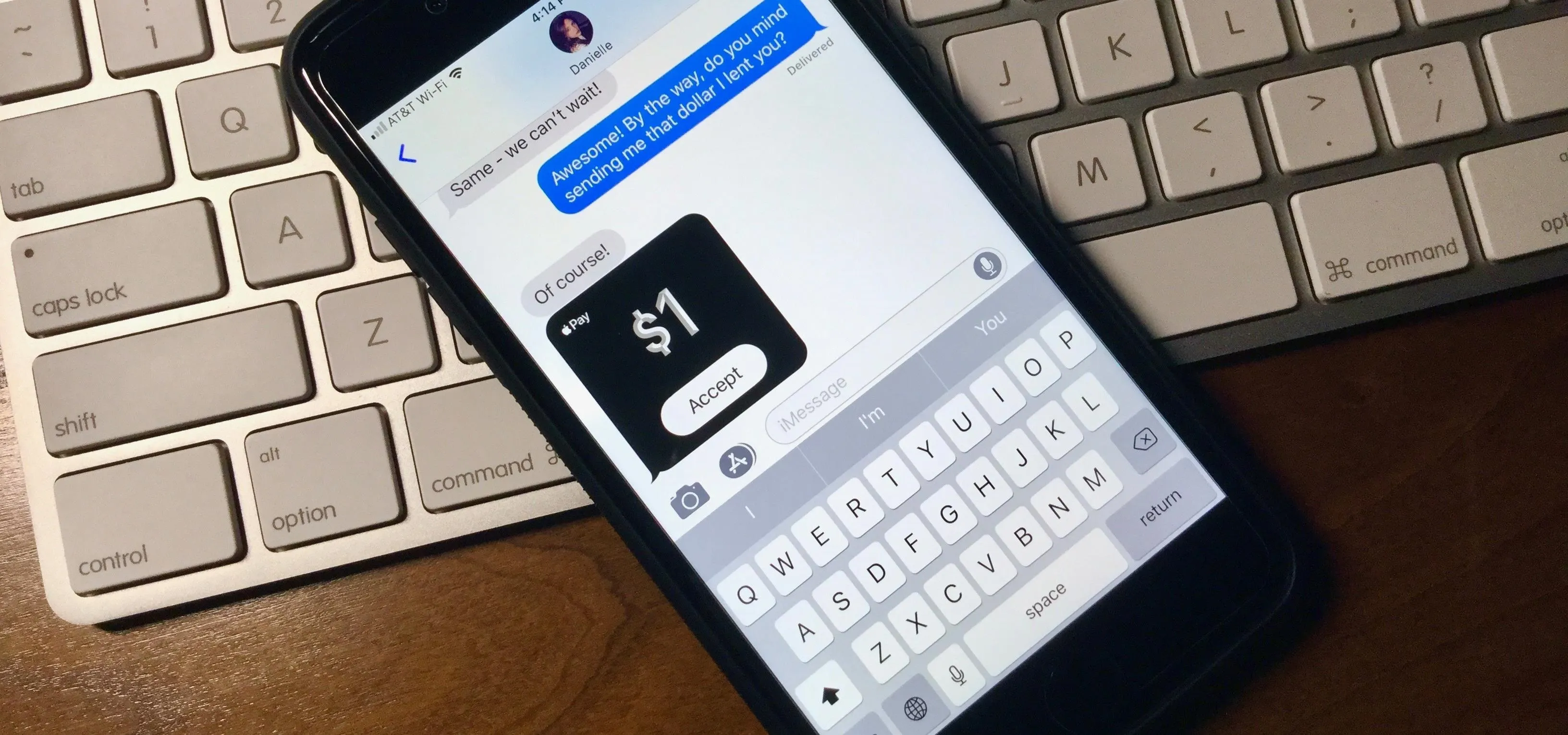 Mobile phone displaying a text message with a $1 payment request.