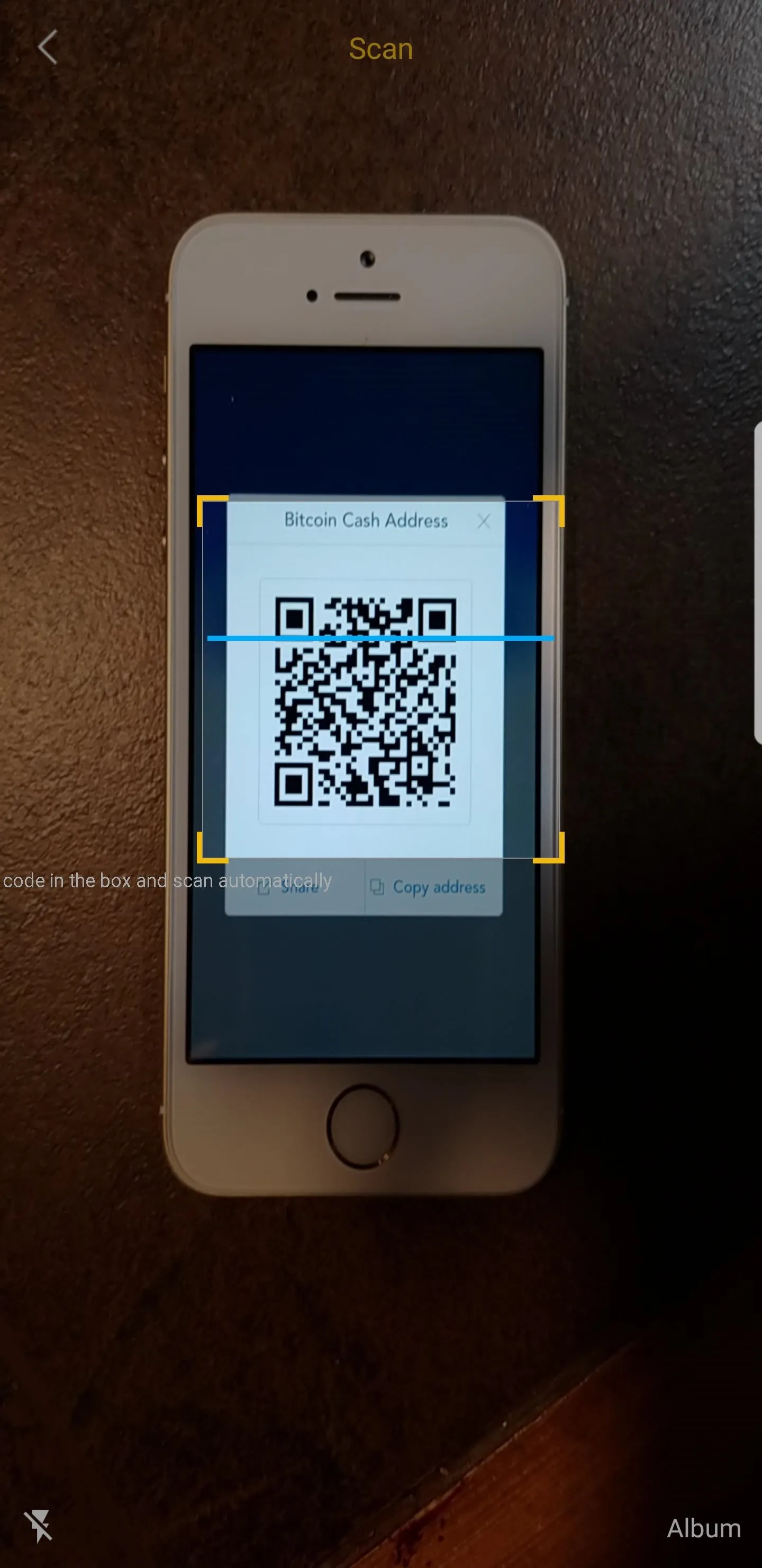 QR code being scanned on a smartphone.