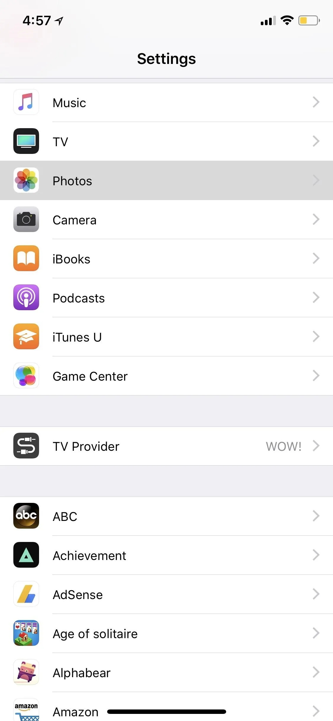 Settings menu on a mobile device with various app options listed.