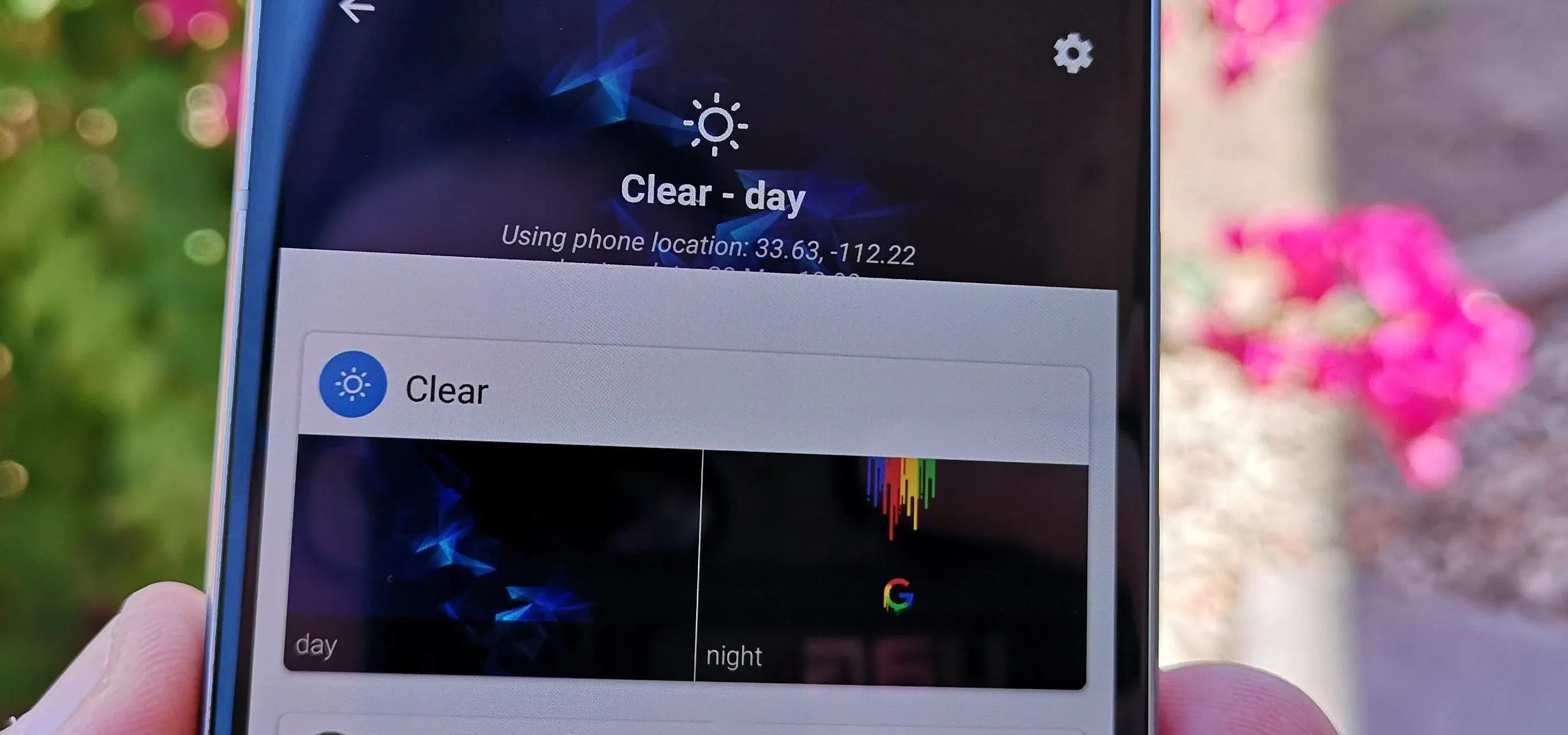 Weather app displaying a clear day forecast on a smartphone.