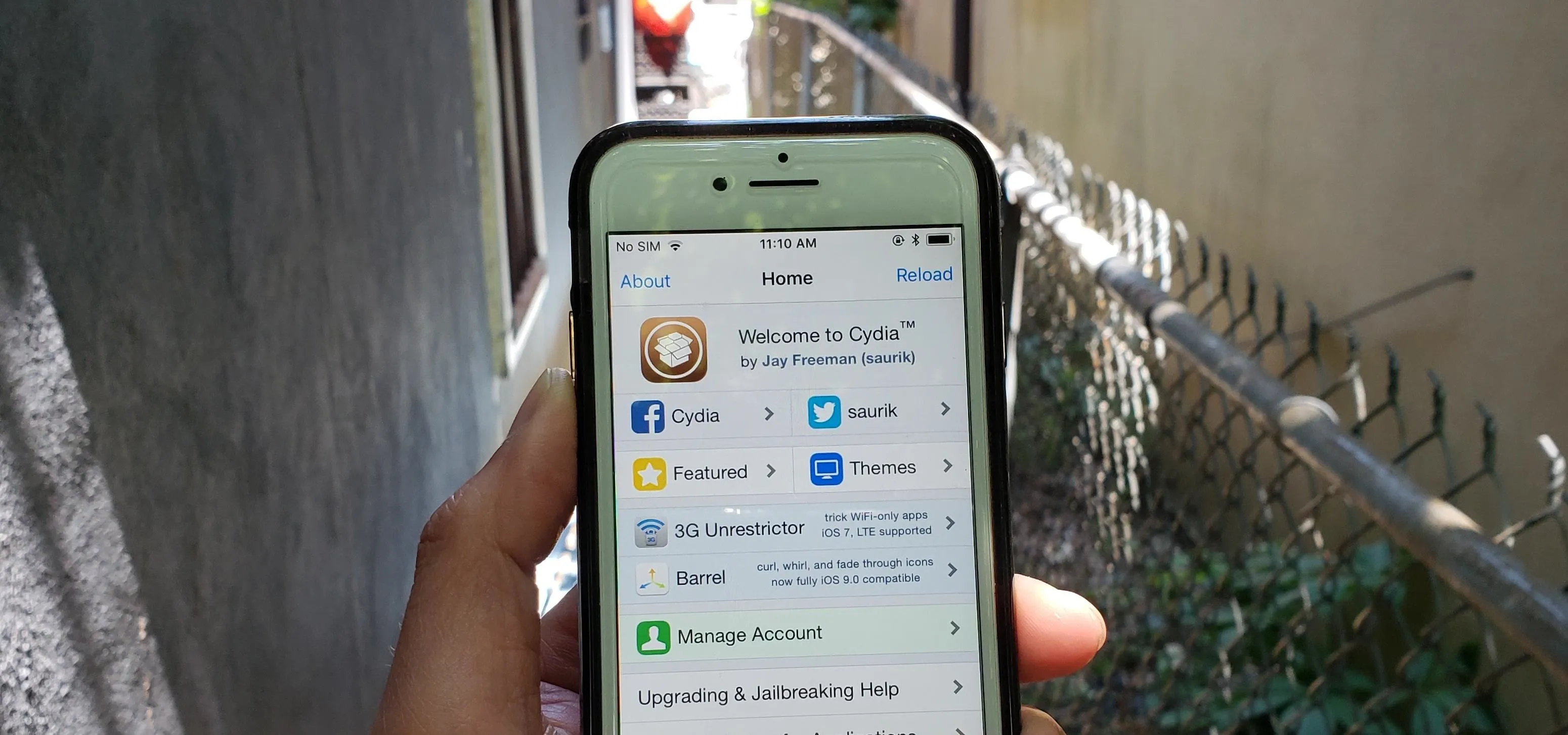 Smartphone displaying app icons and a blurred outdoor background.