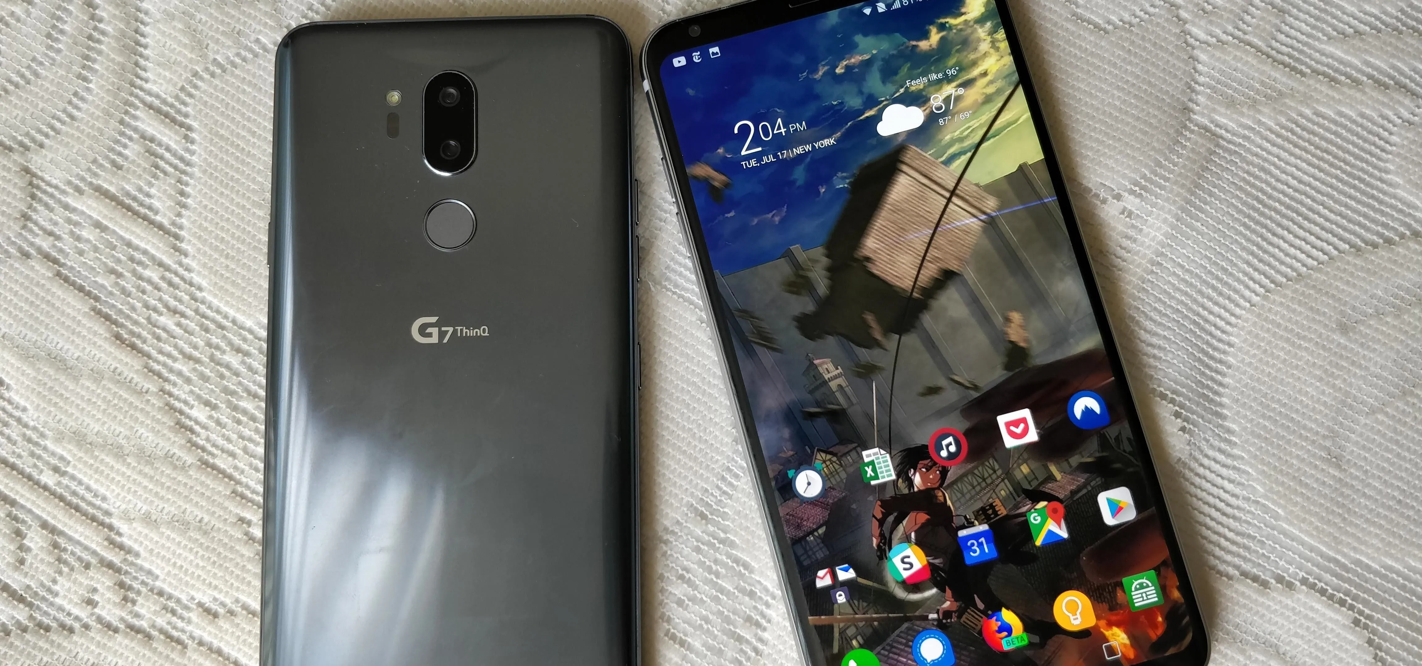Smartphone with a home screen displaying various app icons.