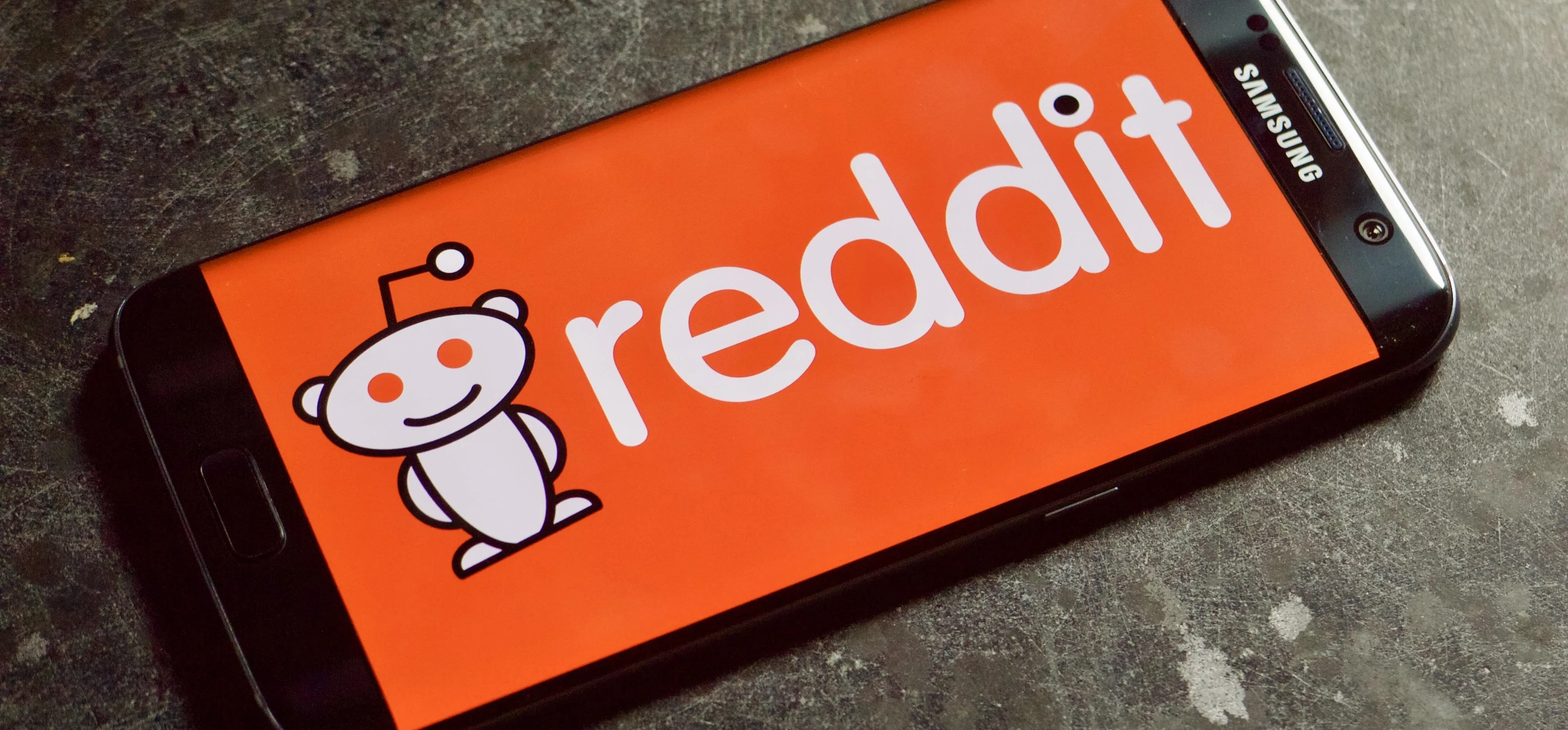 Reddit logo displayed on a smartphone screen.