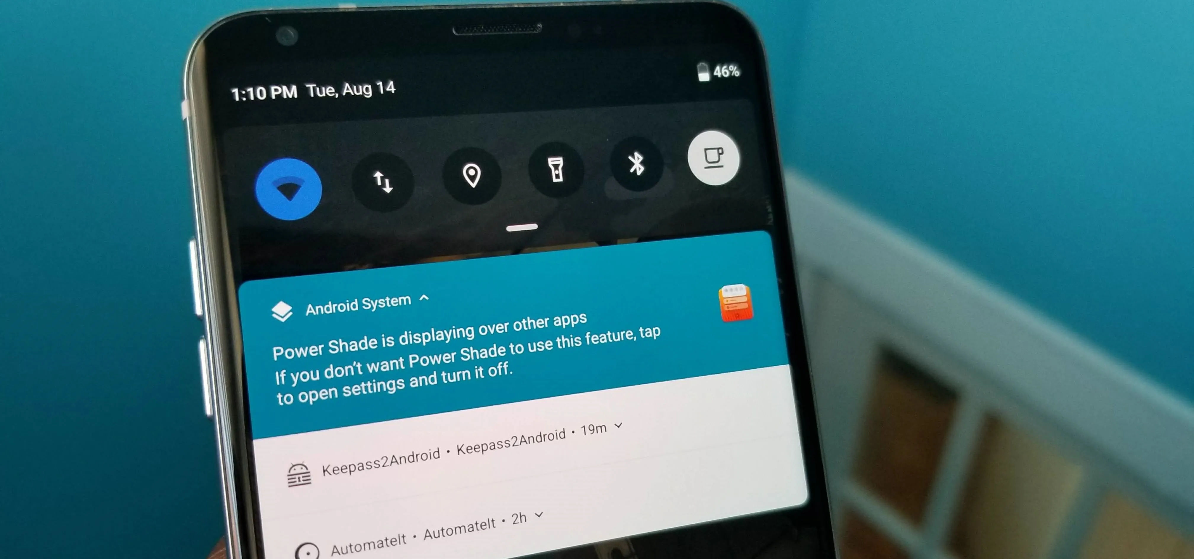 Smartphone screen displaying a notification and quick settings menu.