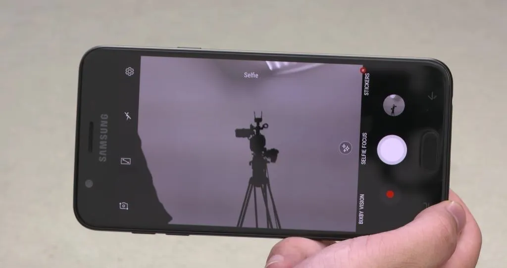 Camera smartphone displaying a tripod with a video camera.