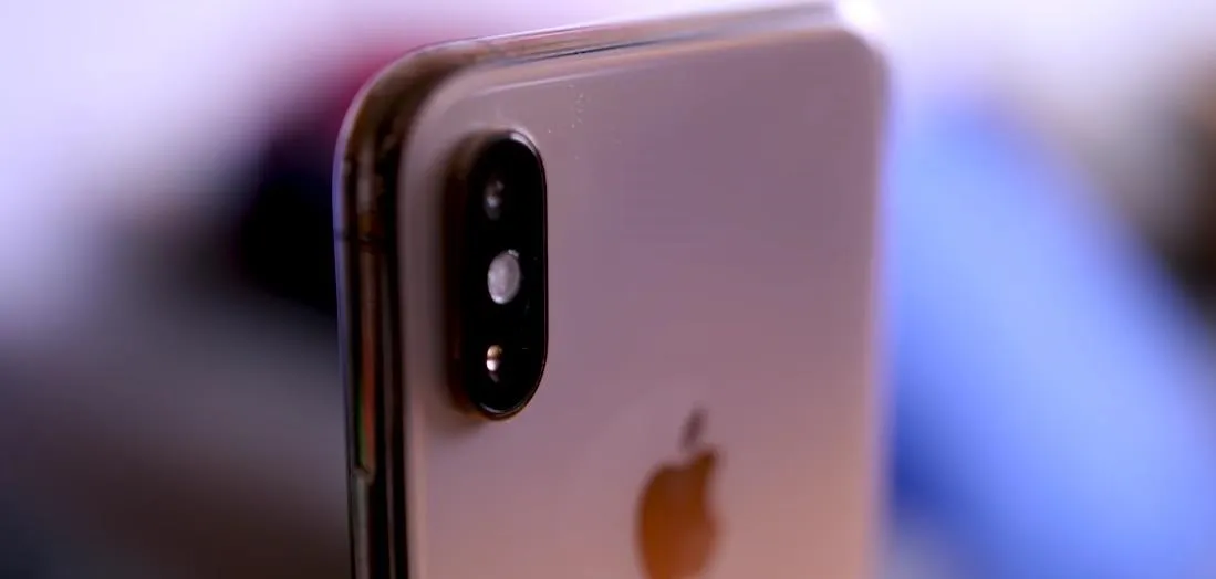 Close-up of the rear camera of an iPhone.