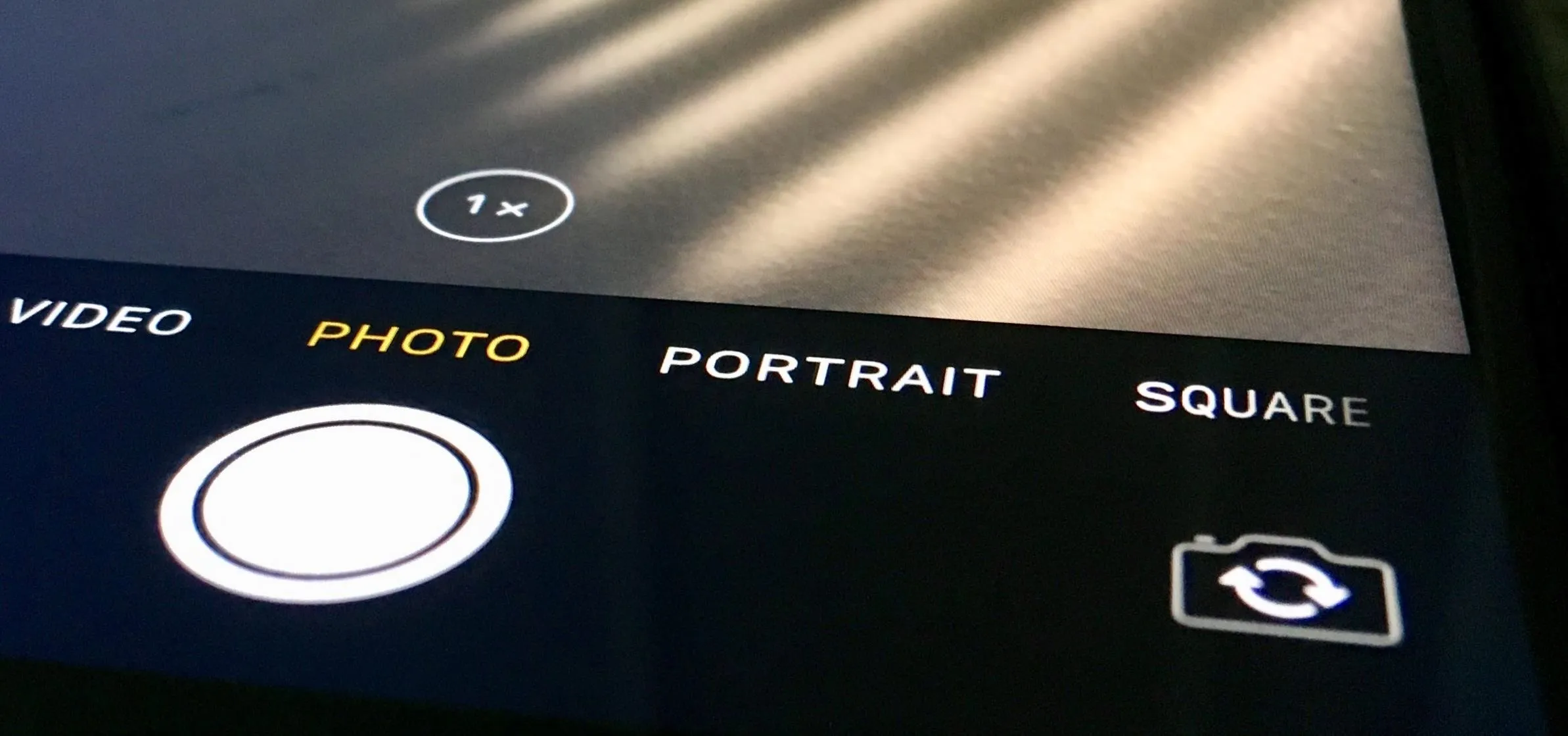 Camera interface with options for photo, video, portrait, and square modes.