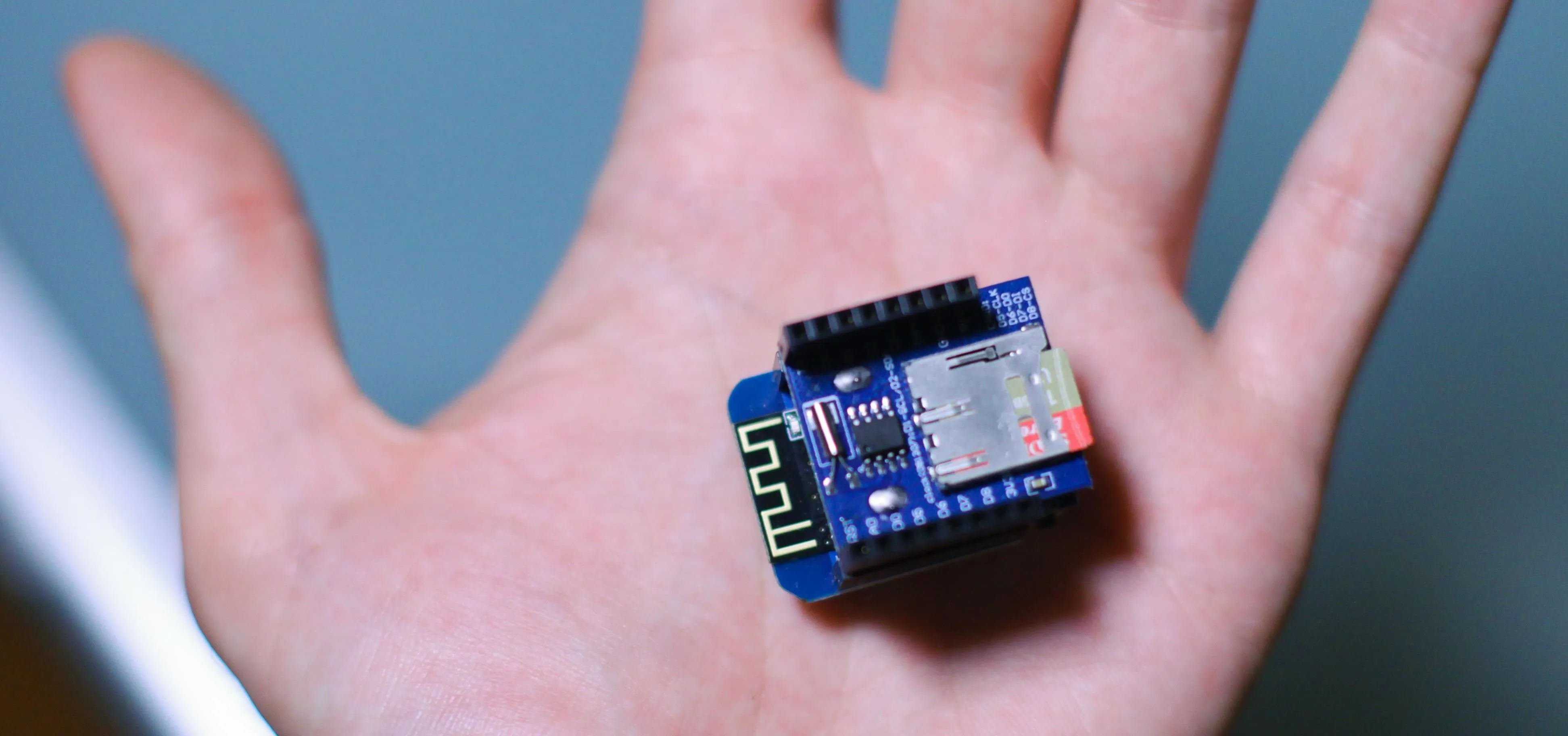 Small electronic circuit board held in hand.
