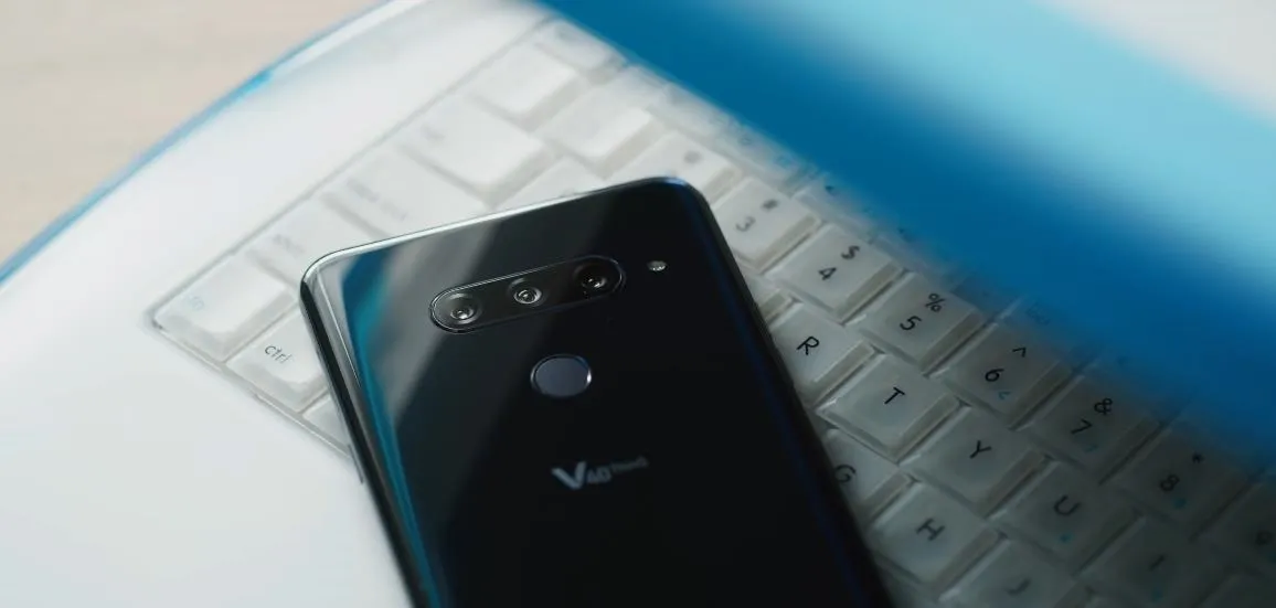 Smartphone resting on a keyboard.