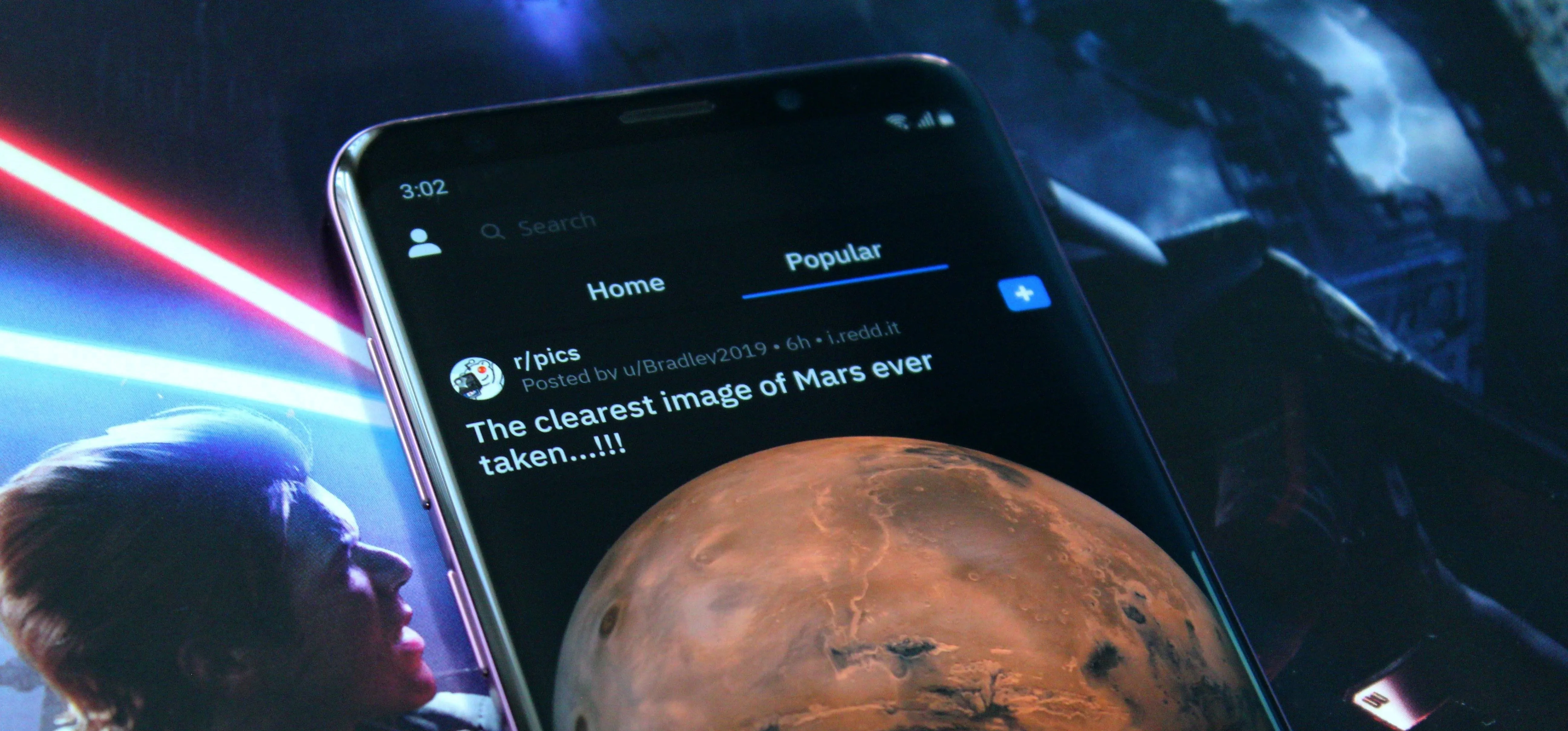 A smartphone displaying a social media post about Mars.