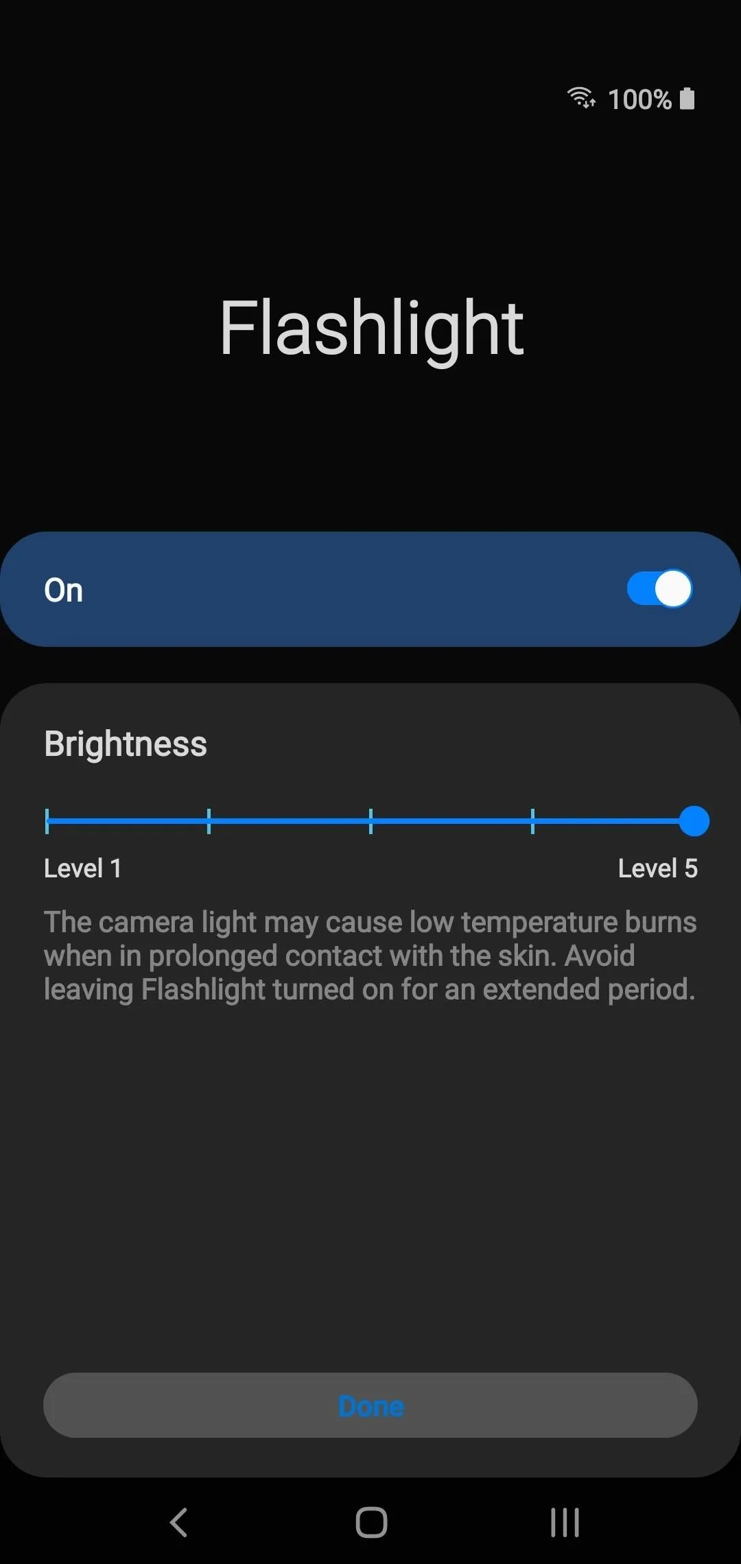 Flashlight settings with brightness adjustment slider.