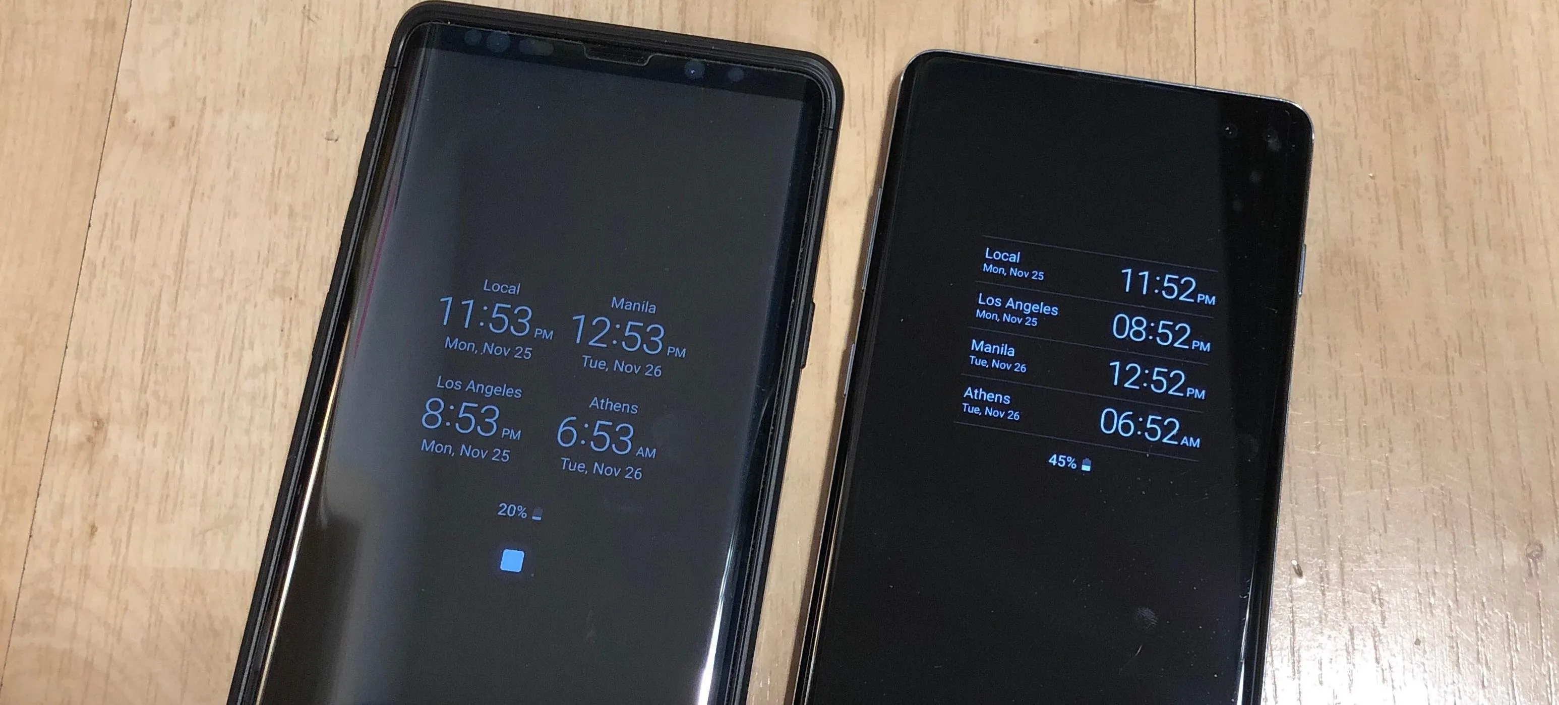 Two smartphones displaying digital time and weather information.
