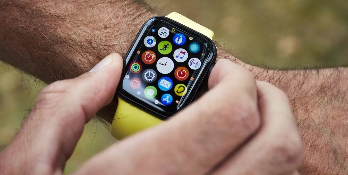 Smartwatch with various app icons displayed on the screen