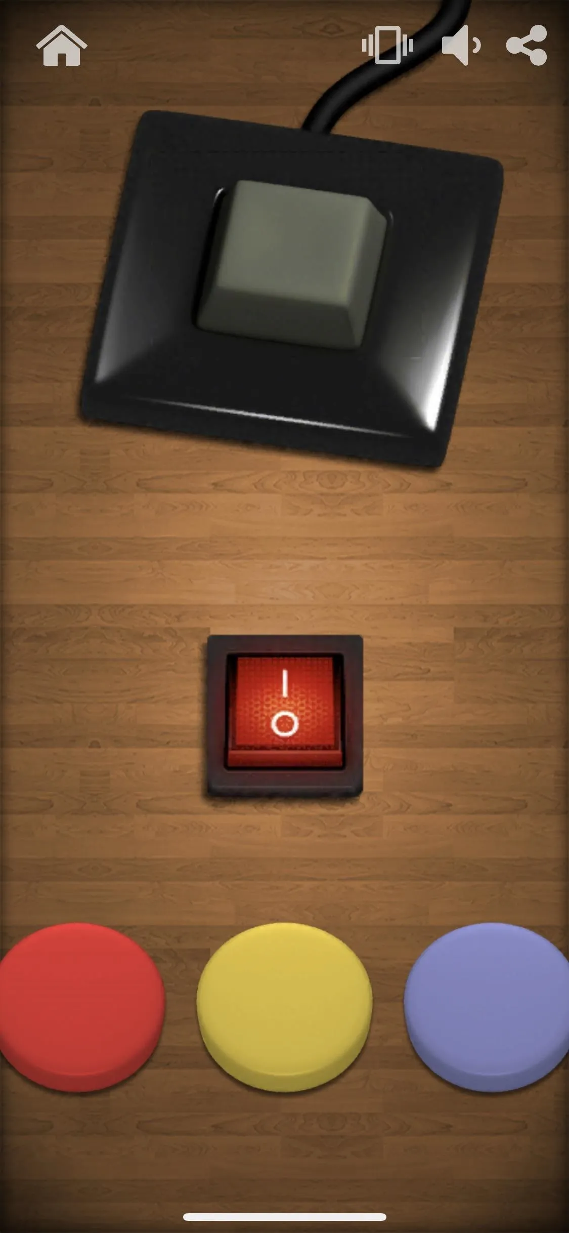 A top-down view of a game interface featuring a black square button, a red button, and three colored circular tokens (red, yellow, purple) on a wooden surface.
