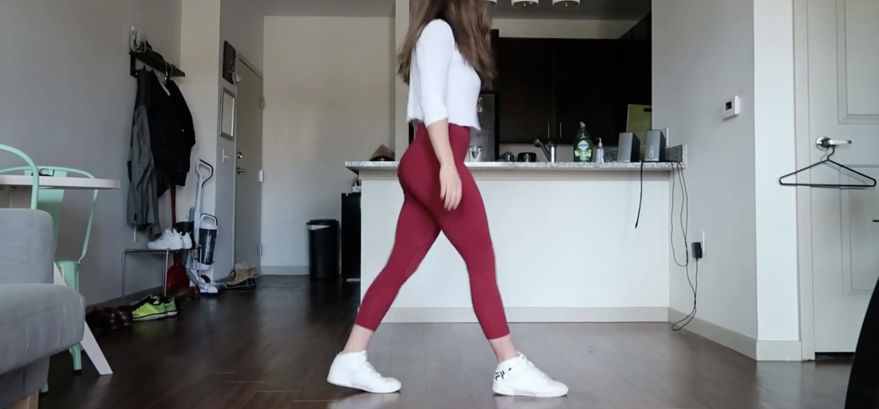 Woman walking in a modern living space.