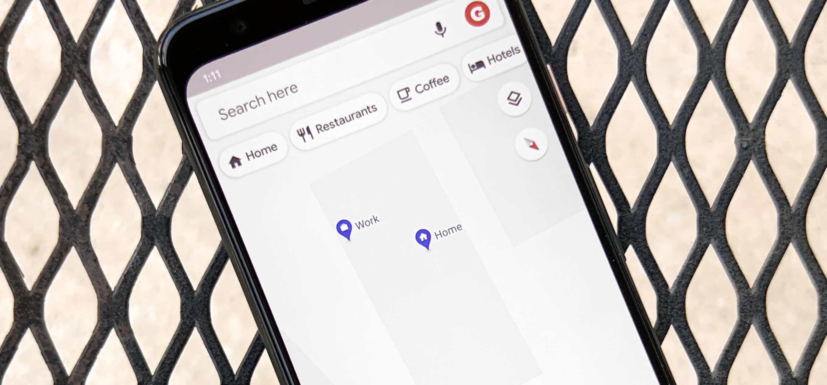 Mobile phone displaying a map with location markers.