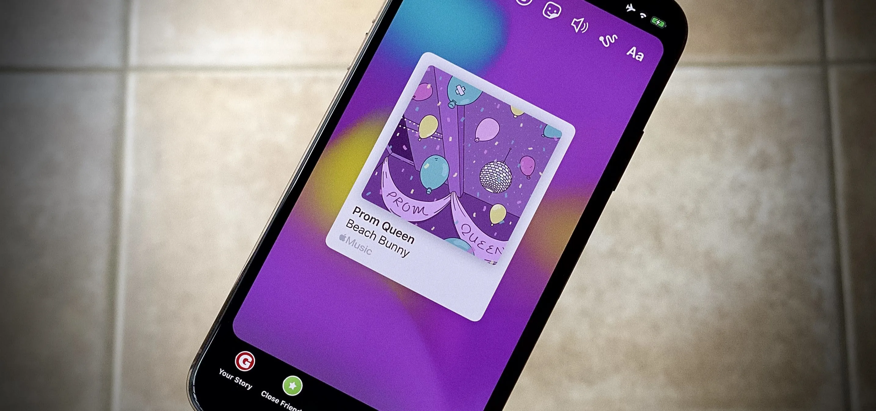 Smartphone displaying a colorful app interface with a card design.