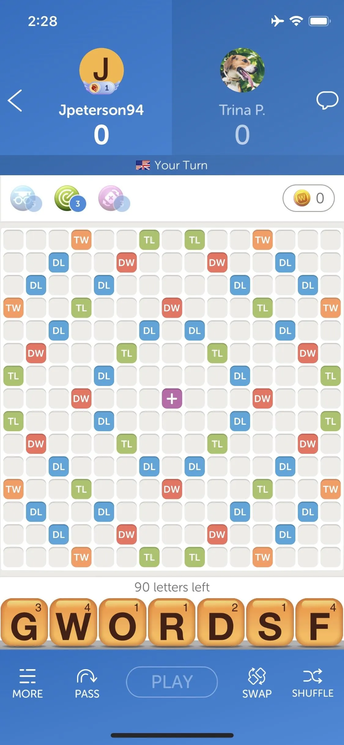 Word game board with colored tiles and letter tiles displayed.