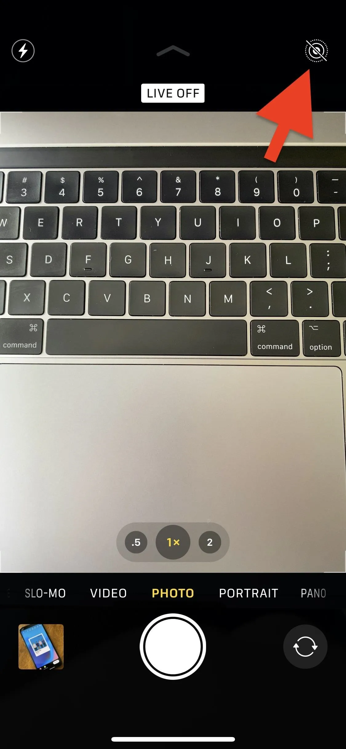 Close-up of a laptop keyboard with a focus on the camera app interface.