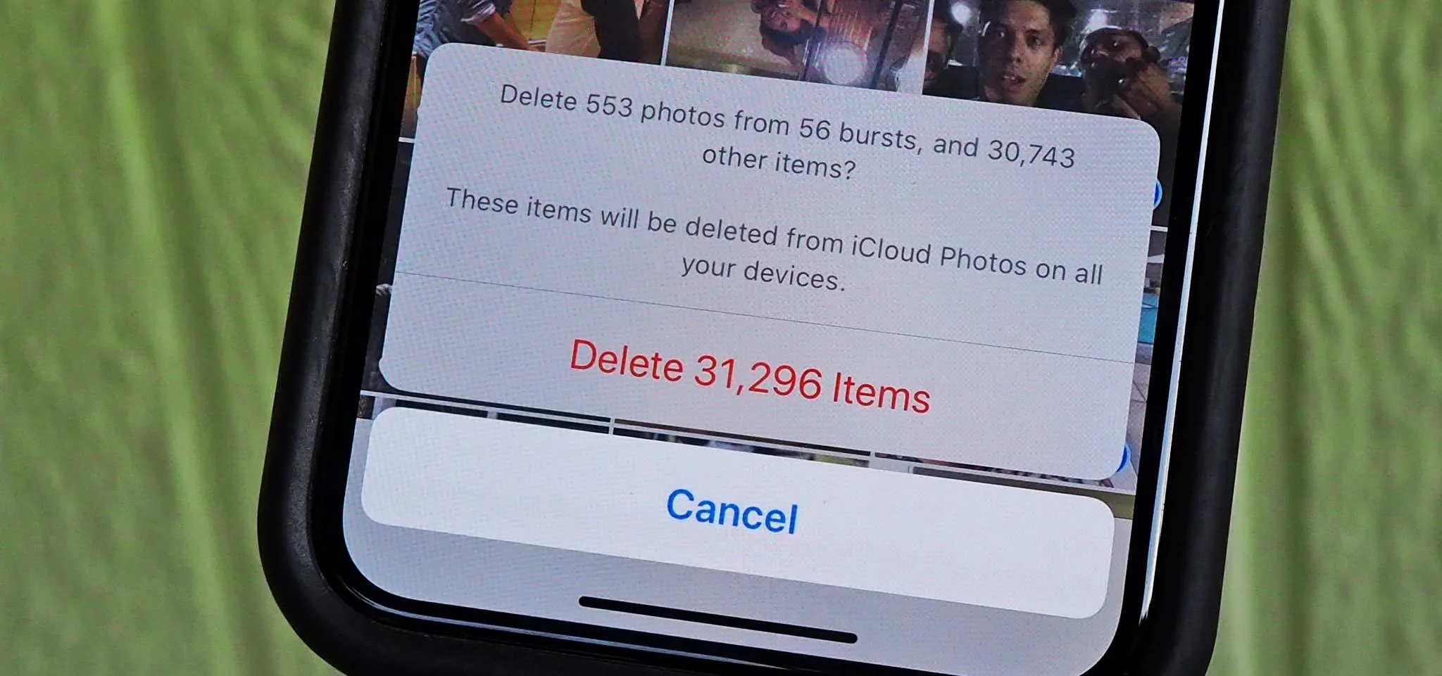 Delete photos confirmation dialog on a smartphone screen.