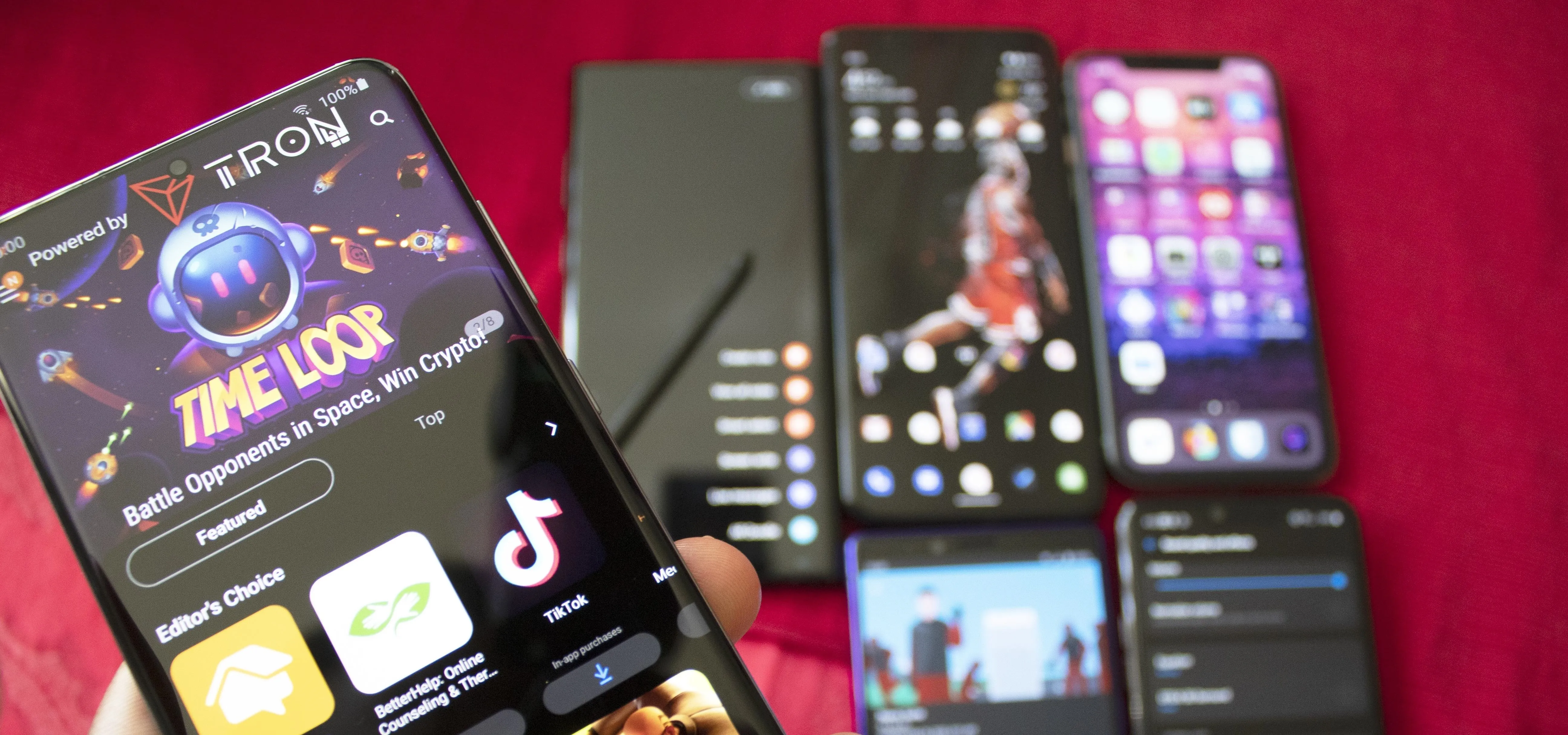 Mobile phones displaying various apps on a colorful background.