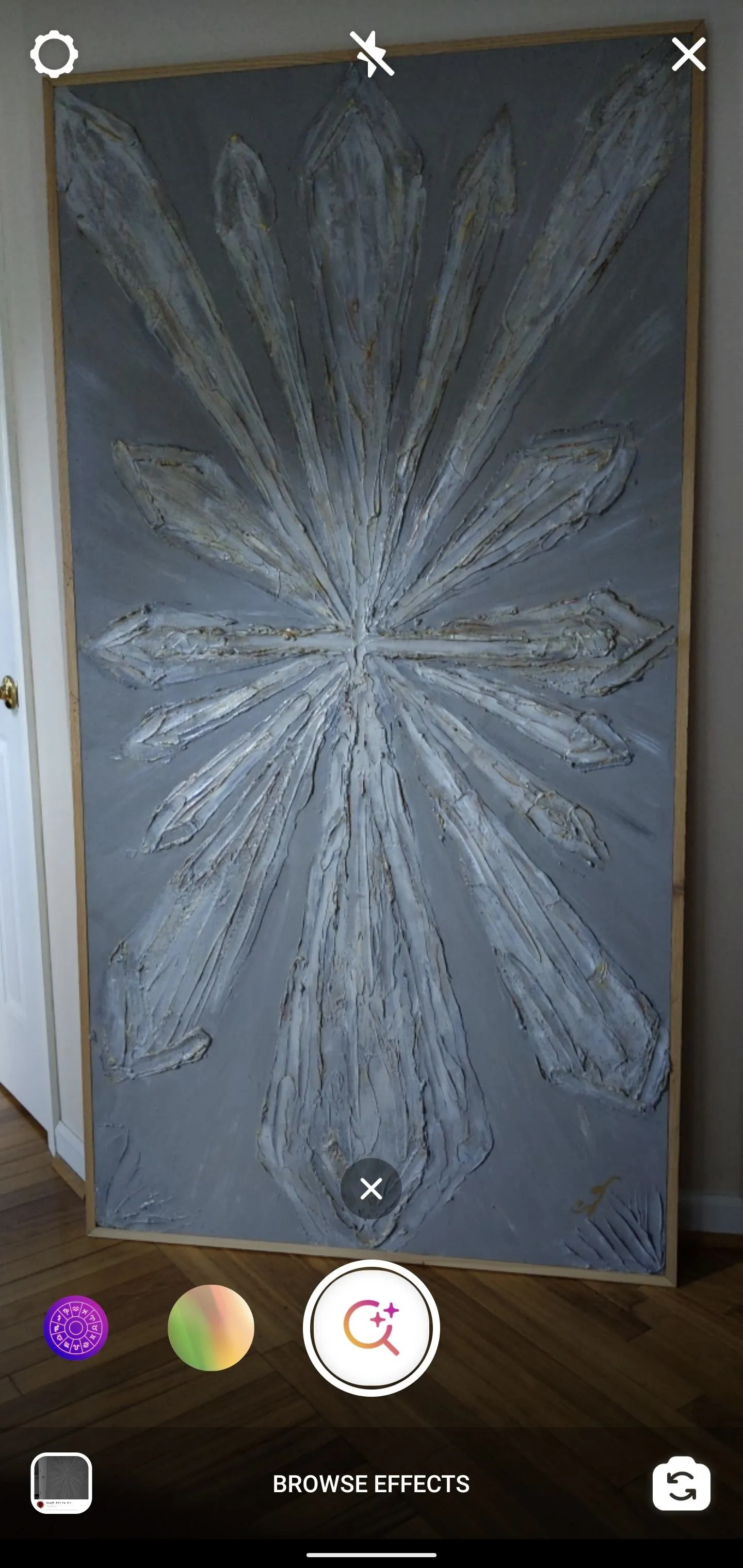 Abstract wall art with a floral design.