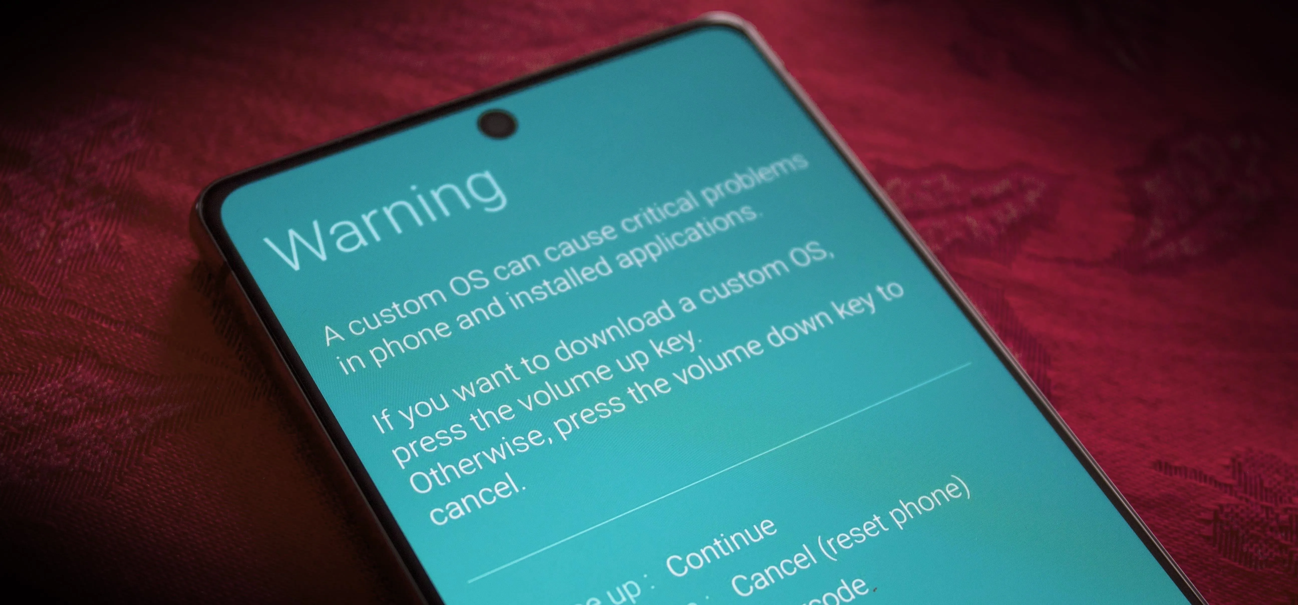Warning message displayed on a smartphone screen regarding custom OS risks.