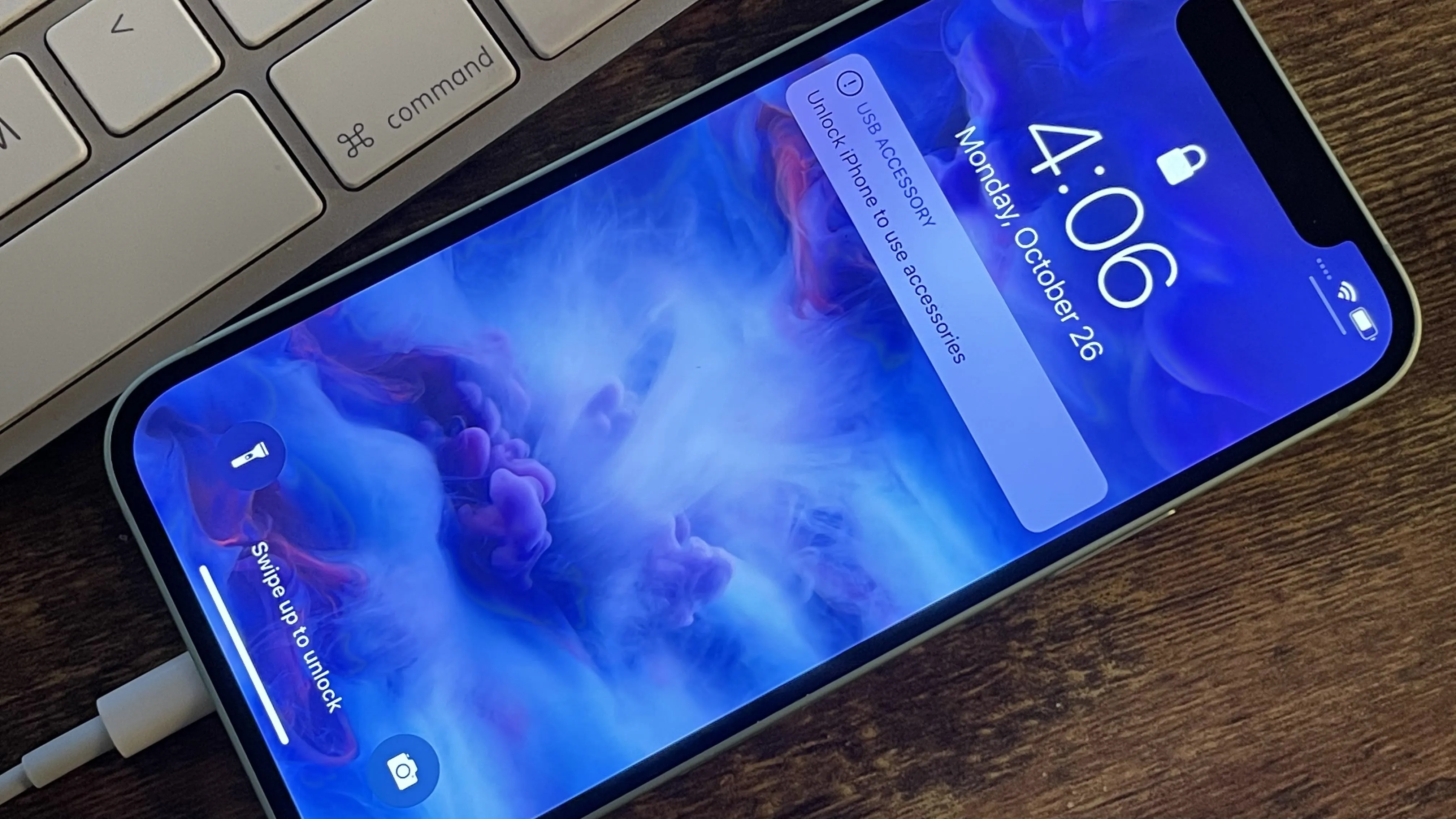 Smartphone displaying a colorful abstract background with a notification on the screen.