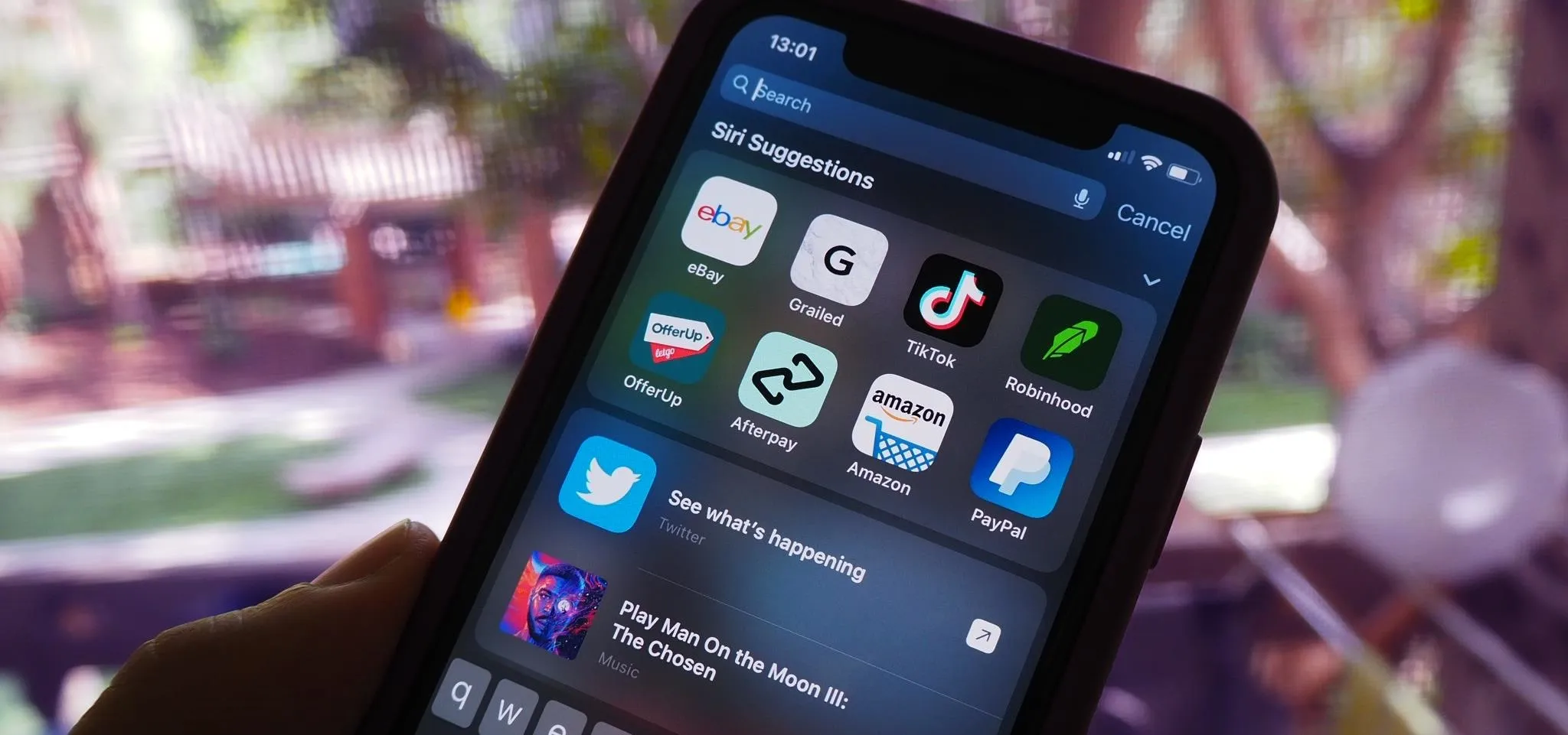 Smartphone displaying various app icons including social media and finance applications.