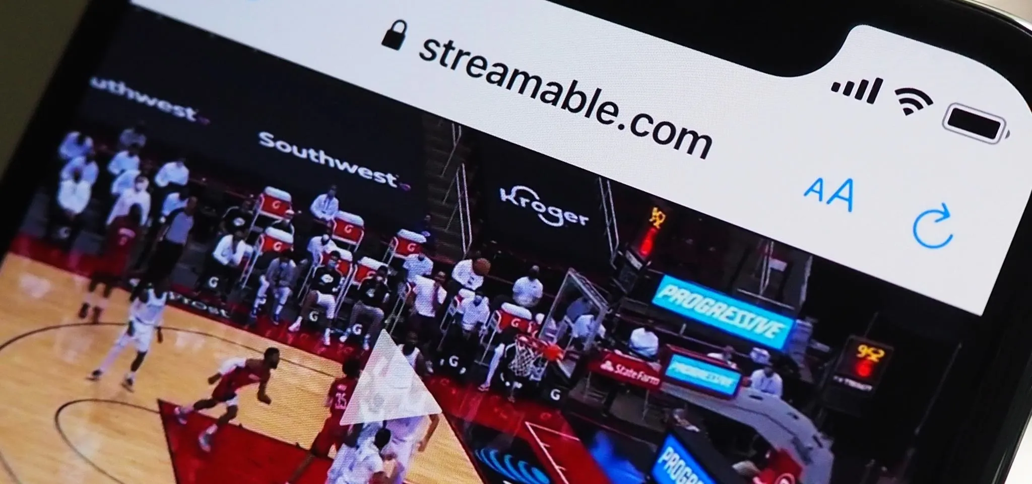 A mobile phone displaying the website Streamable.com with a sports video.