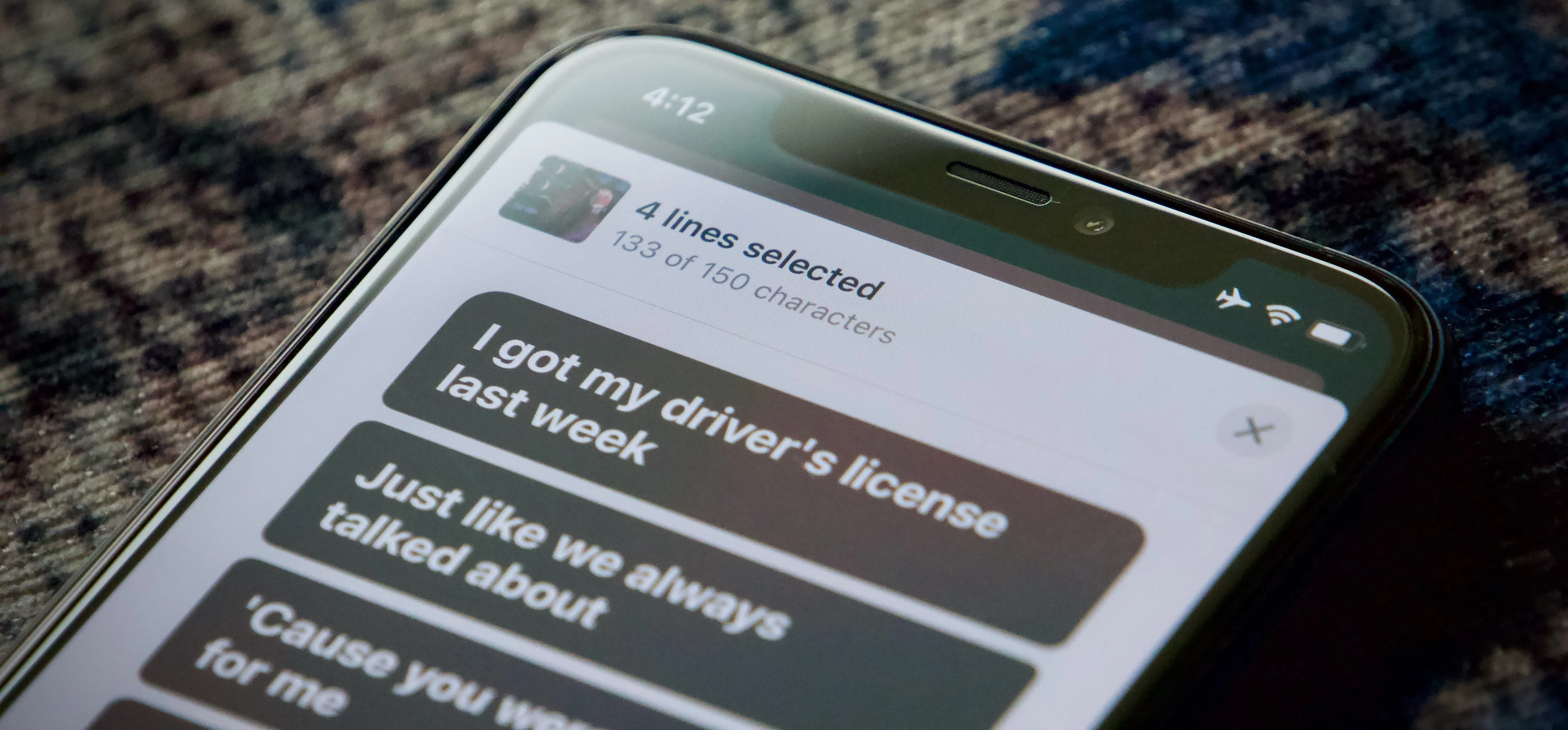 Text message conversation on a smartphone about obtaining a driver's license.