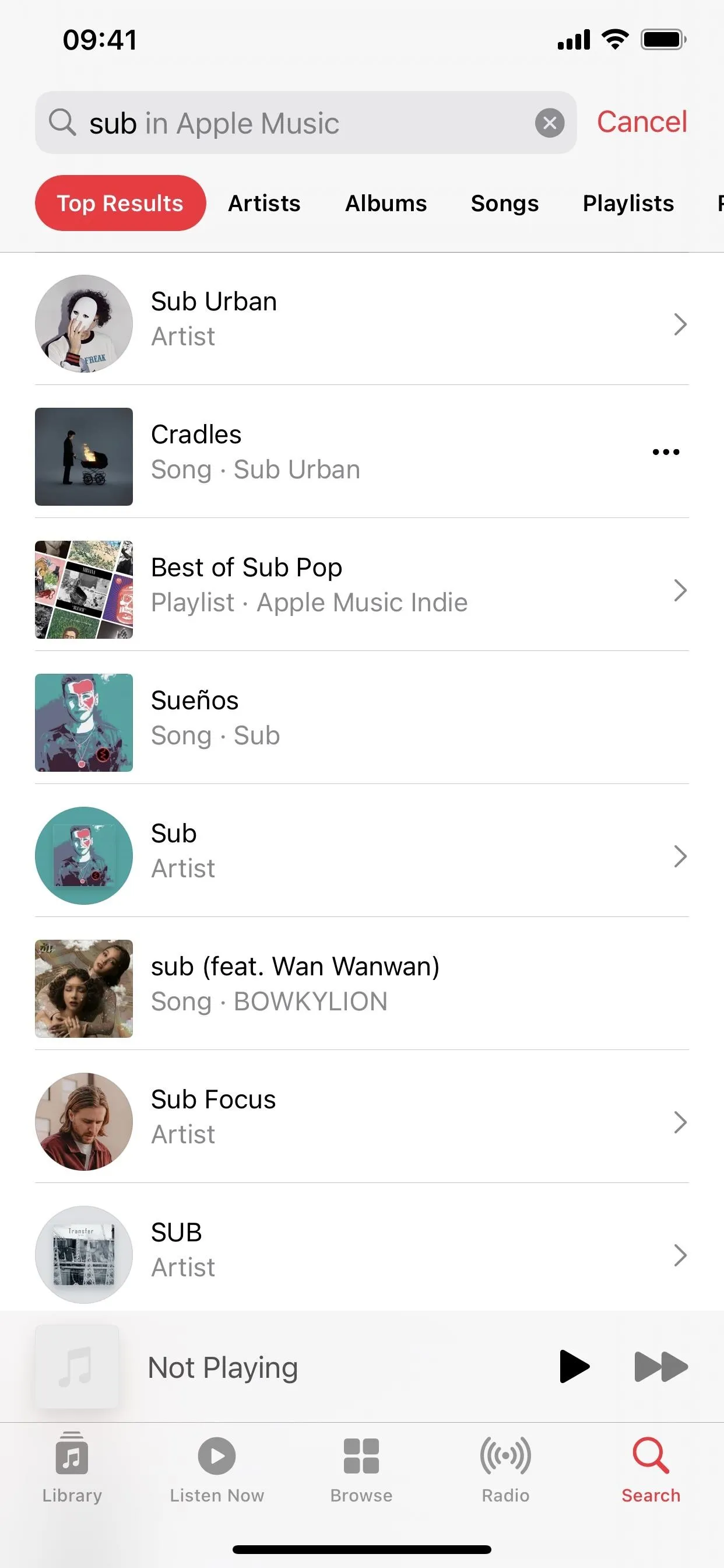 Music library interface displaying various artists, albums, and playlists.