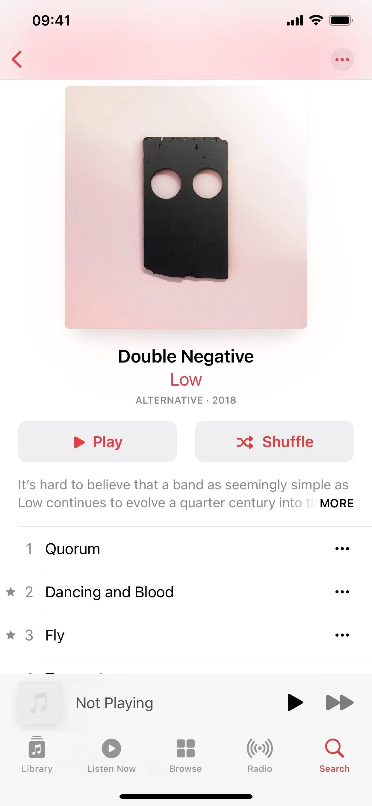 Double Negatives album cover featuring a minimalist black design with two circular cutouts.