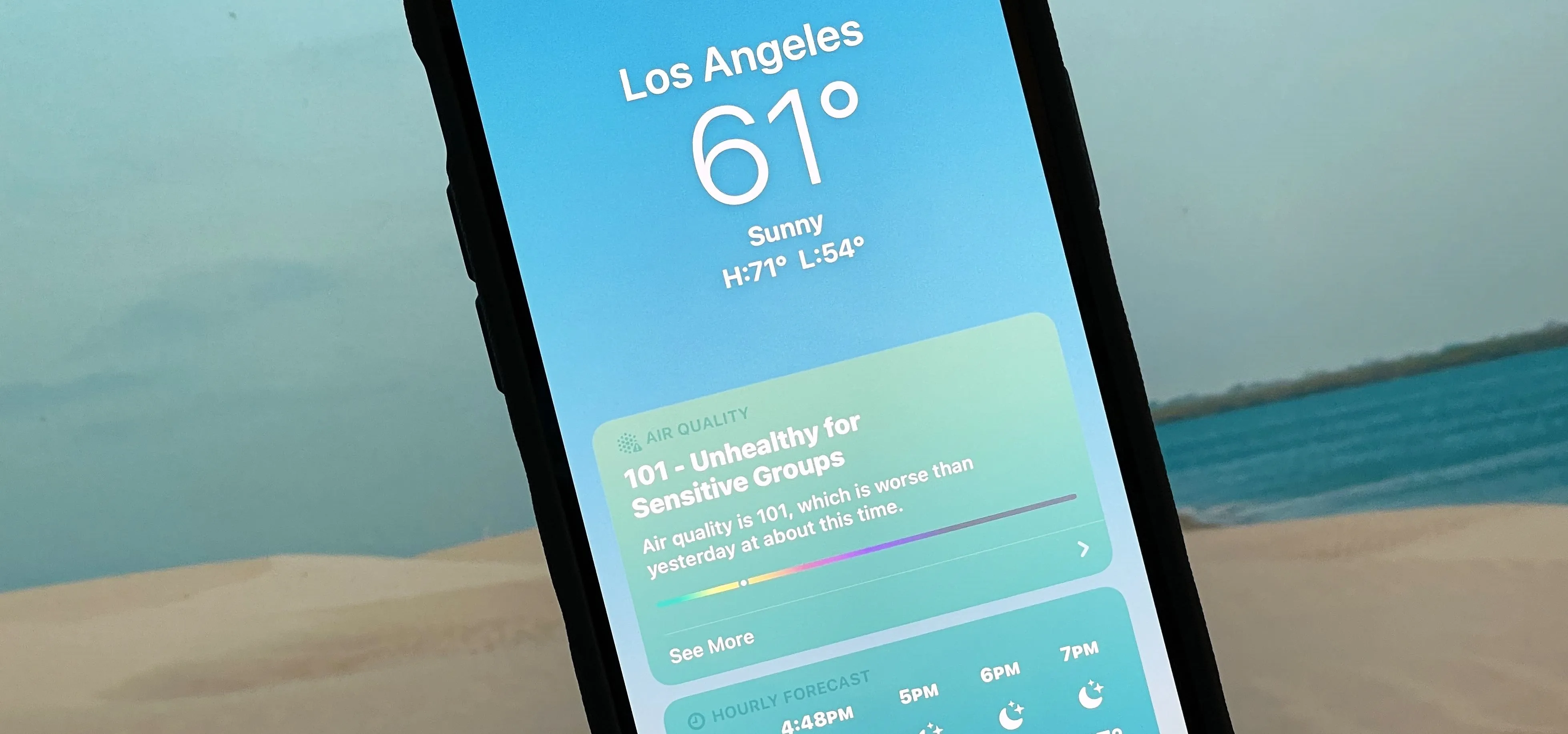 Weather app displaying a sunny 61°F in Los Angeles.