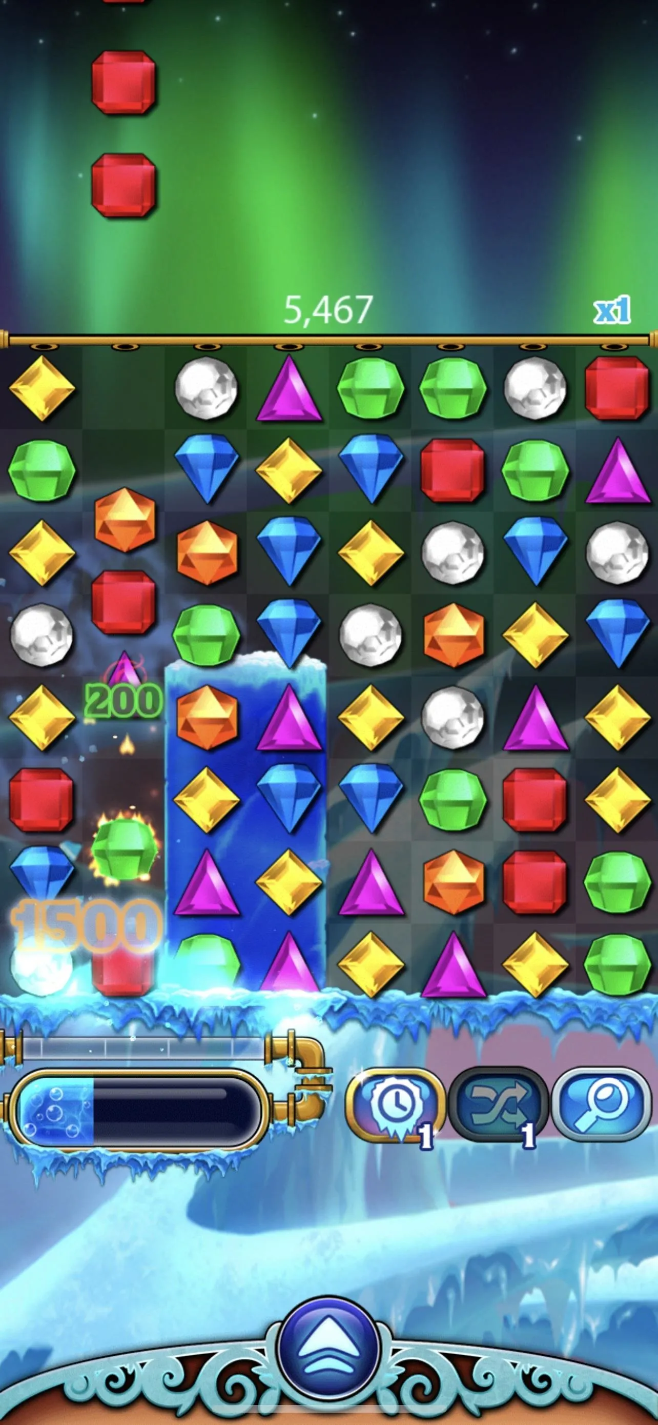 Colorful jewel-themed puzzle game interface with various shapes and colors.