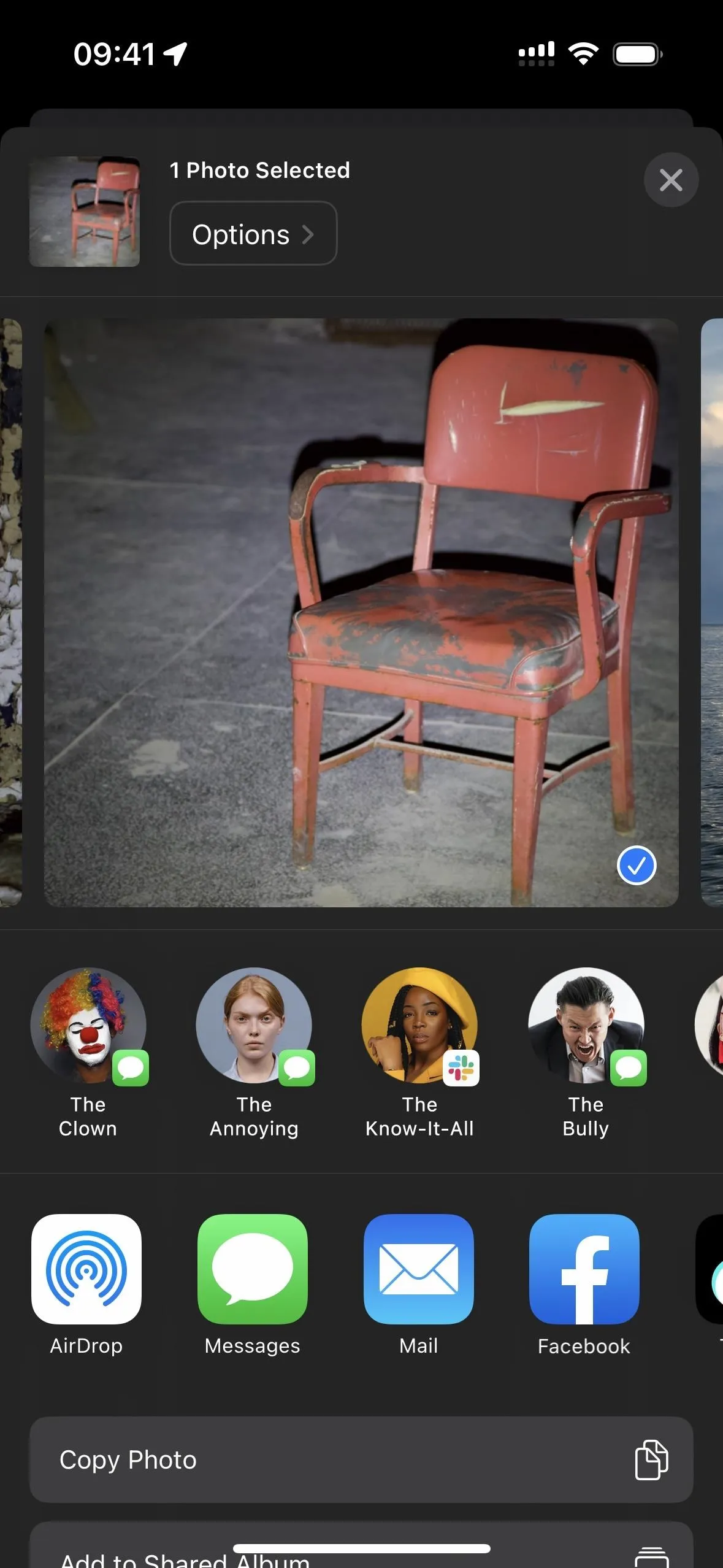 Rustic red metal chair on a dark background.