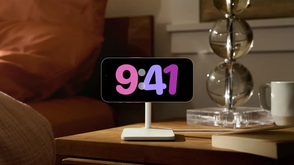 Digital clock displaying 9:41 on a bedside table.
